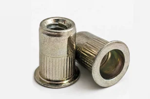 An image of two threaded inserts.
